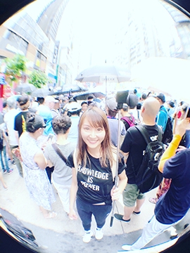 Winnie shot through a fisheye lens in crowd of people