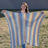 Nat McGartland with a handmade blanket
